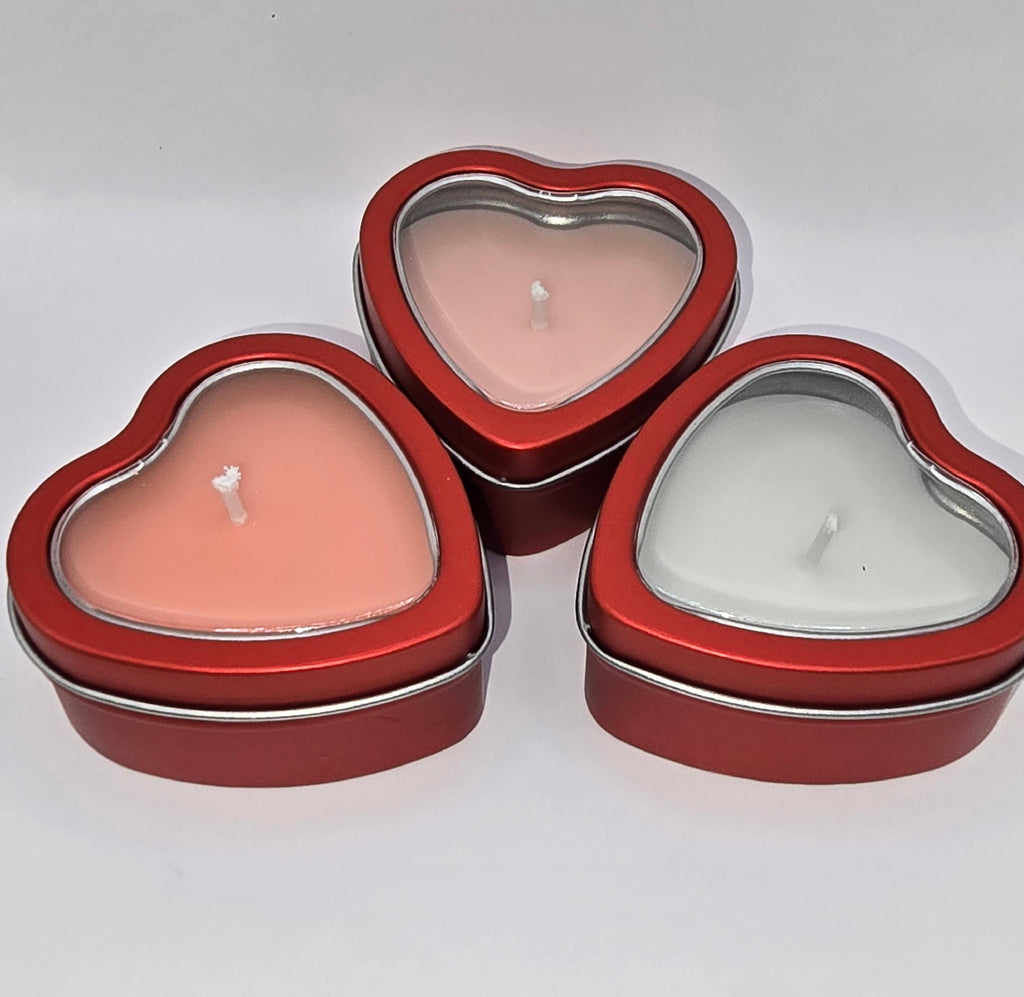 Red heart-shaped candles in tin set