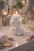 White Girl with Blindfold candle soy-wax sculpture with pearl detail on vanity