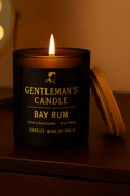 Gentleman's Candle Bay Rum on a wooden surface with a warm glow.