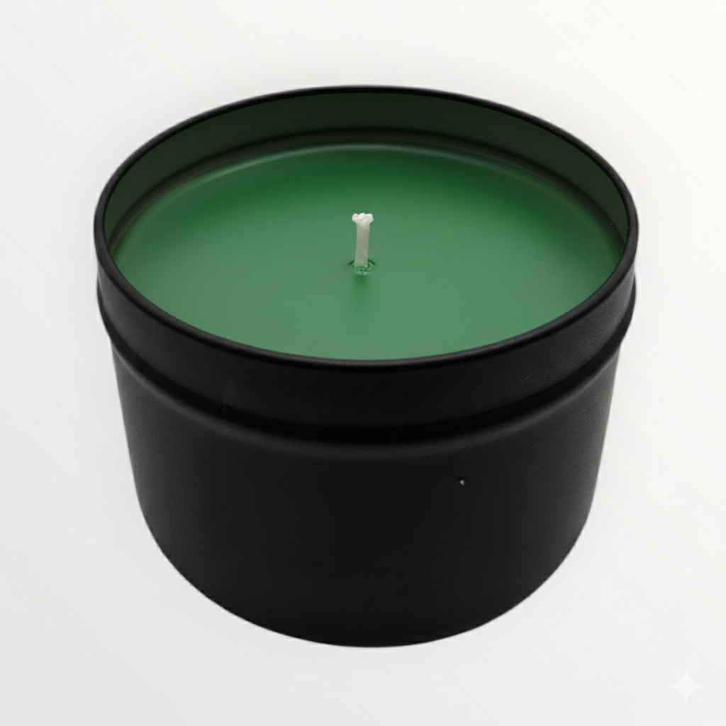 Green candle in a black container on a white background